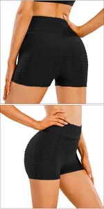Close-up of black high-waisted yoga shorts featuring honeycomb textured fabric and scrunch butt detail