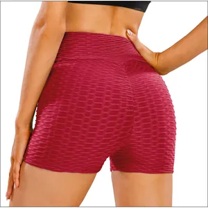 Macro detail of wine red scrunch butt yoga shorts with honeycomb texture fabric