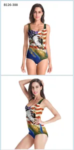 Detailed view of women's one-piece swimsuit featuring USA eagle and flag digital prints