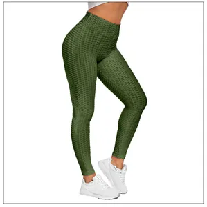 Detail view of olive green scrunch textured leggings with high-waist elastic fabric
