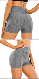 Detail showing the gray honeycomb textured high waist scrunch butt gym shorts for women