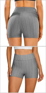 Detail of high-waist grey scrunch yoga shorts featuring textured honeycomb fabric