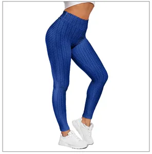 Detail showing the royal blue honeycomb texture and high waist seam of the gym leggings