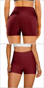Detail of high waist burgundy honeycomb textured yoga shorts with ruched peach butt lift