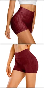 Macro detail of high-waist yoga shorts with textured honeycomb fabric in burgundy
