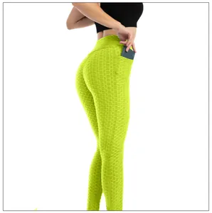 Dettaglio dei leggings da yoga verde neon a nido d'ape con tasca per cellulare
