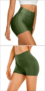 Detail showing high-waisted olive green honeycomb textured compression yoga shorts
