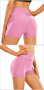 Detail of pink honeycomb textured high waist yoga shorts with scrunch butt lifting design
