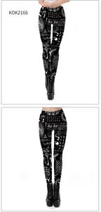 Detail view of 3D occult patterns on black leggings with occult eye and moon graphics