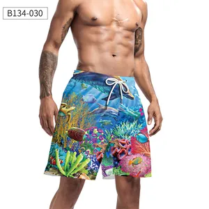 Detailed view of men's quick-dry beach shorts featuring an underwater world coral reef print