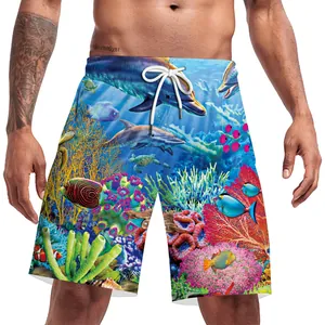 Detail of tropical fish and dolphin print on quick-dry men's beach shorts with drawstring