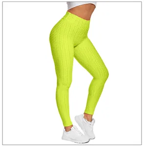Macro detail of high waist textured honeycomb leggings in vibrant fluorescent yellow