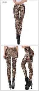 Detail view of leopard print leggings featuring black side panels and metallic zippers
