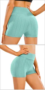 Detail of high waist mint green honeycomb yoga shorts with scrunch butt texture