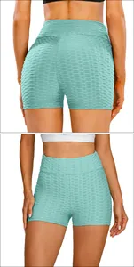 Detail of high waisted honeycomb textured yoga shorts in light blue with scrunch butt design