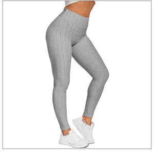 Detailed honeycomb texture of high-waisted grey yoga leggings with booty lifting effect