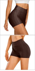 Macro detail of high-waist yoga shorts with honeycomb texture and ribbed waistband
