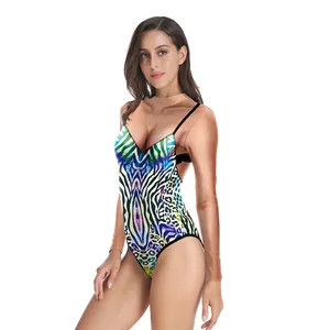 Detail of vibrant 3D leopard print on high-cut swimsuit with sheer long sleeves