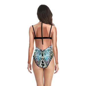 Rear view of long sleeve swimsuit featuring colorful 3D zebra print and mesh back panels