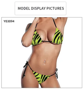 Detail of neon green and zebra print bikini set with halter top and side-tie bottoms
