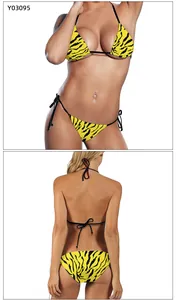 Detail view of yellow tiger print bikini set showing front and back lace-up style