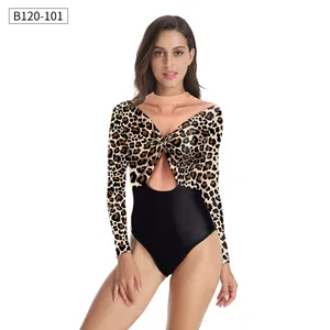 Close-up of leopard print long-sleeve bodysuit with twist knot and teardrop cutout detail