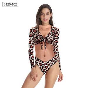Detailed view of the leopard print long sleeve swimsuit with deep V-neck and tie-front