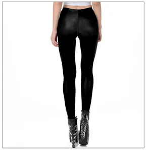 Rear view of high-waist glossy black skeleton floral print leggings and studded boots