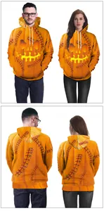 Detail of Halloween pumpkin hoodie with jack-o'-lantern face and black stitch patterns