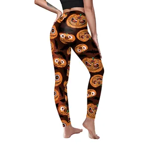 Women's Halloween yoga leggings with pumpkin and bat prints on dark brown stretch fabric