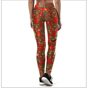 Close-up of red Christmas leggings featuring festive tree and star prints for women