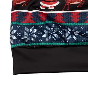 Christmas sweatshirt detail showing Santa Claus print and black ribbed elastic hemline