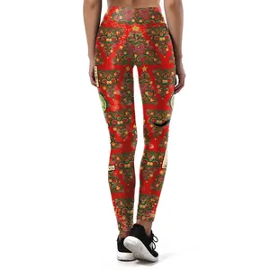 Women's red Christmas yoga leggings featuring green tree and gold star patterns