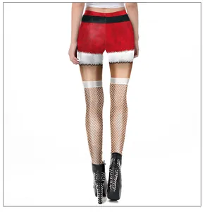 Vue détaillée du legging de Noël avec imprimé velours rouge et motif résille blanc
