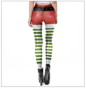Detail of Christmas leggings featuring red sequins and green-white striped patterns