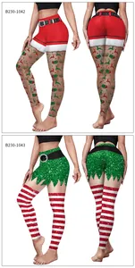 Detail view of high-waist Christmas yoga leggings with festive Santa and elf patterns