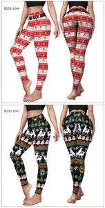 Detail view of high-waist yoga pants featuring Christmas Santa and reindeer patterns