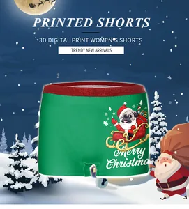 Detail of Christmas pug 3D digital print on emerald green women boy shorts with red sequins