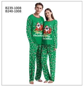 Close-up of matching dark green Christmas pajamas with pug Santa and festive motifs