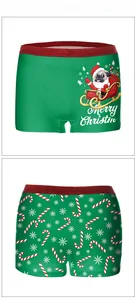 Detail of Christmas pug sled and candy cane digital prints on festive boxer briefs