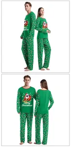 Close-up of Christmas pajama set with pug sledding print and candy cane patterned pants