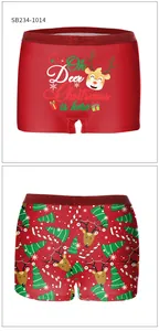 Detail of red Christmas boxer briefs with reindeer prints and glitter elastic waistbands