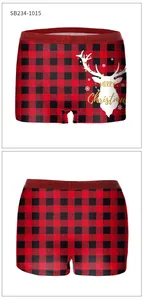 Detailed view of red buffalo plaid Christmas boy shorts with festive reindeer print