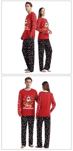 Detail of Christmas pajamas featuring a festive pug print and candy cane patterned pants