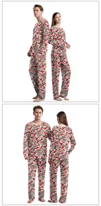 Detailed view of Christmas pajama sets with festive cat prints for couples on white background