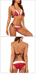 Nahaufnahme eines glitzernden rot-weißen Bikinis mit schwarzen Trägern für Damen