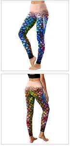 Detail showing high-waist fit and vibrant fish scale print on these yoga leggings