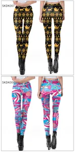 Detail of Christmas leggings featuring Santa Claus, reindeer, and candy cane prints