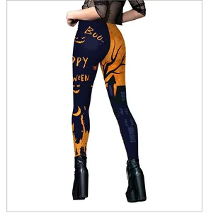 Detail of Halloween leggings showing orange pumpkin and spook house prints on elastic fabric