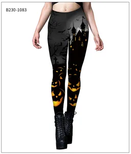 Detail of Halloween leggings with spooky pumpkin and castle prints on black fabric